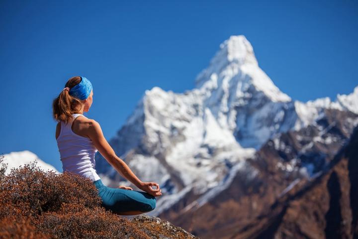 dharmshala ashram lady meditating top of a hill