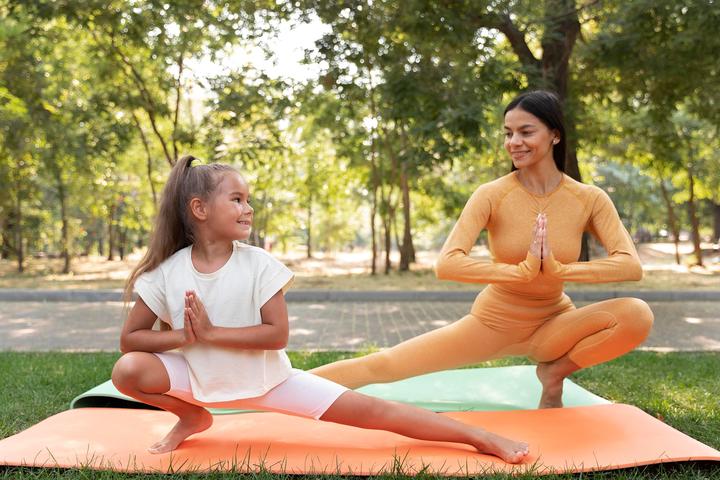 full-shot-smiley-girl-woman-doing-yoga1