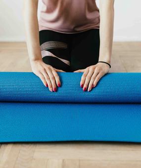 lady-with-yoga-mat-folding