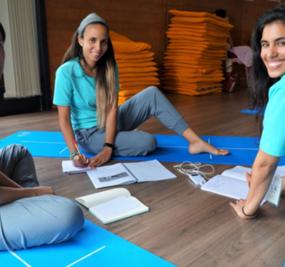 A group of mixed girls doing yoga tasks Art-Of-Living-Center-Dharamshala_image5